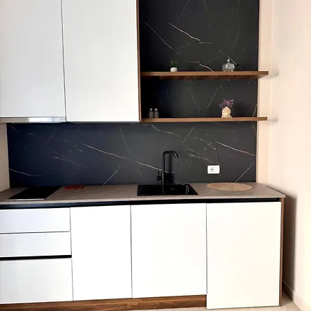 White Arena Apartments Golem